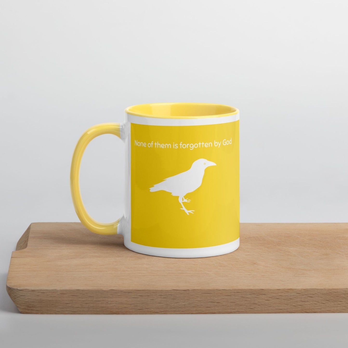 'Consider the Ravens' - bright yellow mug